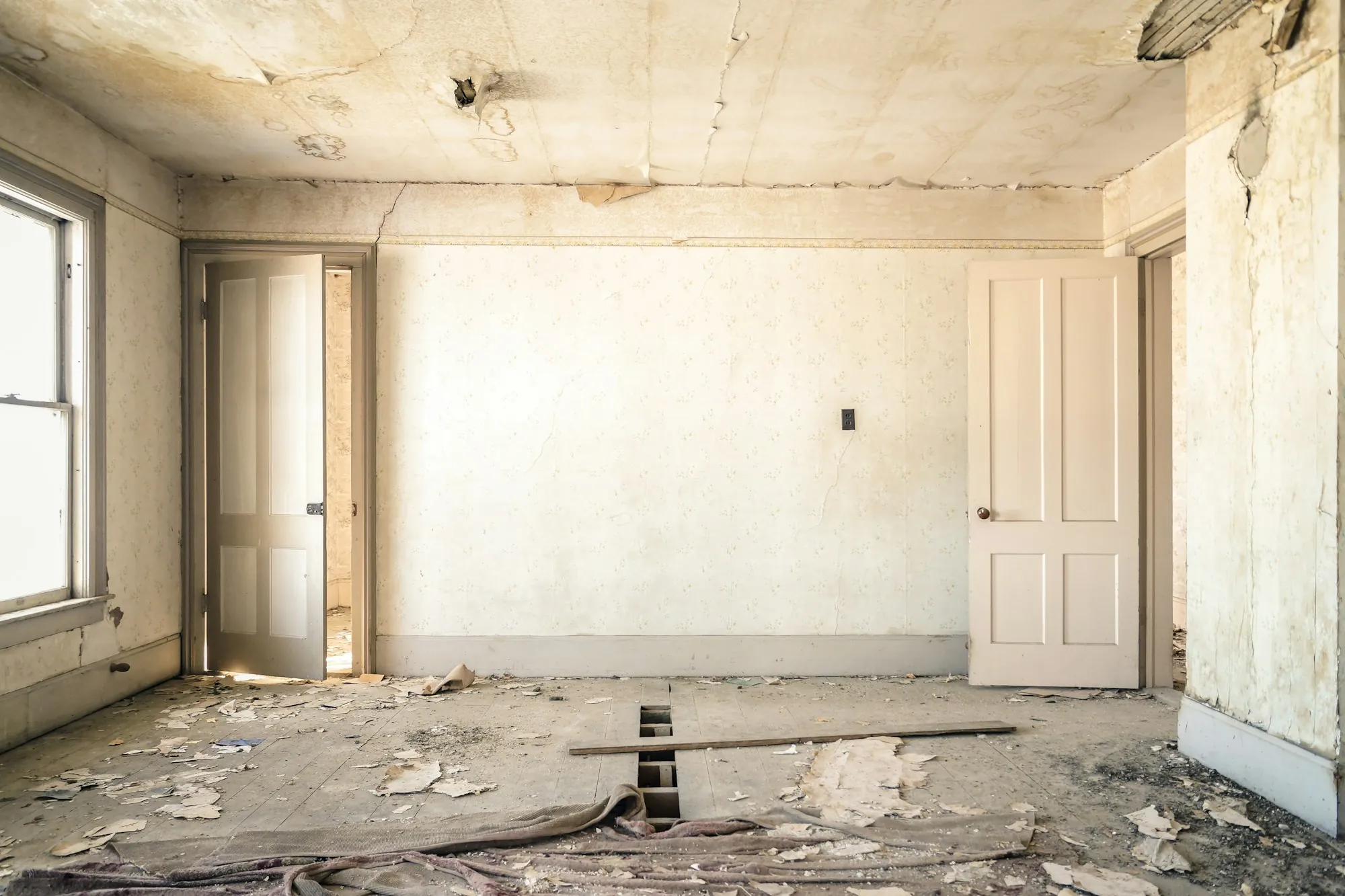 House mid-renovation with new drywall and an opened-up floor plan